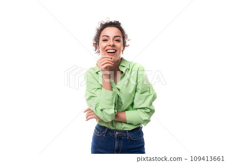 young charming caucasian secretary woman with black curly hair tied up in a ponytail smiling on a young charming caucasian secretary woman with black curly hair tied up in a ponytail smiling on a 109413661