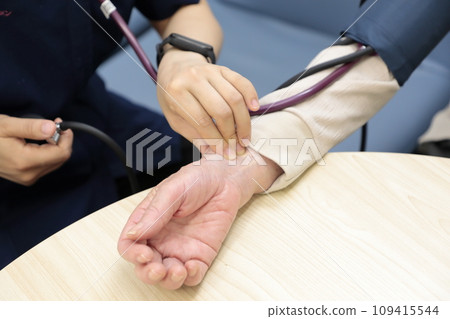 Elderly people having their vitals checked Elderly people having their vitals checked 109415544