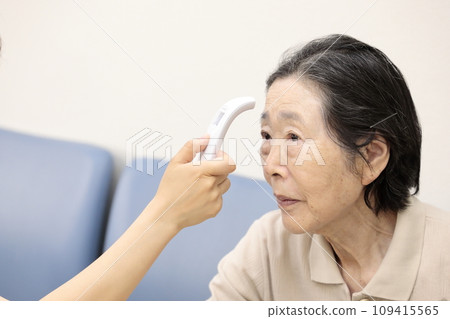 Elderly people having their vitals checked Elderly people having their vitals checked 109415565