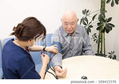 Elderly people having their vitals checked Elderly people having their vitals checked 109415570