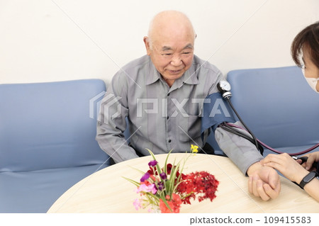 Elderly people having their vitals checked Elderly people having their vitals checked 109415583
