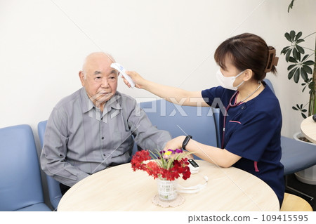 Elderly people having their vitals checked 109415595