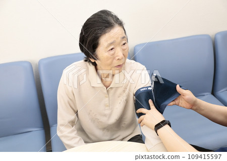 Elderly people having their vitals checked Elderly people having their vitals checked 109415597
