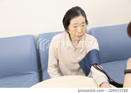 Elderly people having their vitals checked Elderly people having their vitals checked 109415598