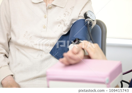 Elderly people having their vitals checked 109415743