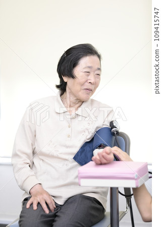 Elderly people having their vitals checked 109415747