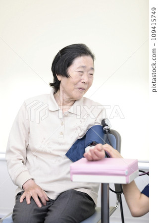 Elderly people having their vitals checked 109415749