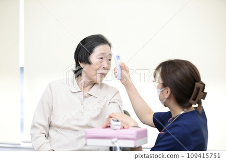 Elderly people having their vitals checked 109415751