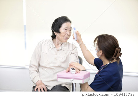 Elderly people having their vitals checked 109415752