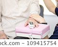 Elderly people having their vitals checked 109415754