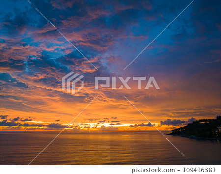 .amazing colorful orange cloud above the ocean in sunset 109416381