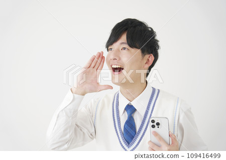 High school boy holding a smartphone and talking, white background 109416499
