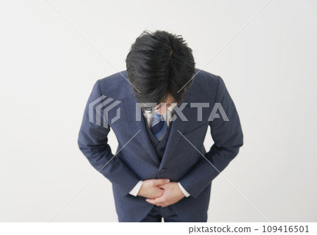 Businessman bowing and apologizing, white background Businessman bowing and apologizing, white background 109416501