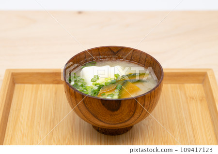 Tofu and pumpkin miso soup served on a wooden tray 109417123