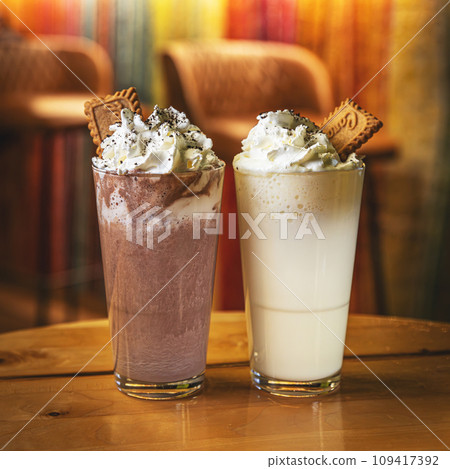 Glass of hot white and dark chocolate 109417392