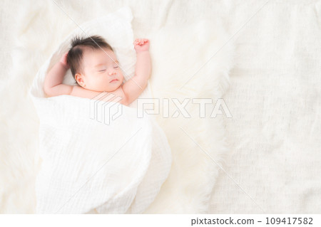One month old boy sleeping wrapped One month old boy sleeping wrapped 109417582