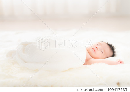 One month old boy sleeping wrapped One month old boy sleeping wrapped 109417585