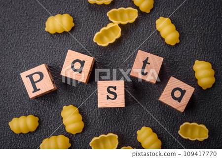 Raw durum wheat gnocchi pasta with salt and spices in a ceramic plate 109417770