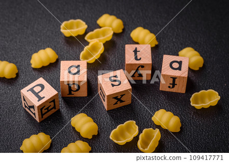 Raw durum wheat gnocchi pasta with salt and spices in a ceramic plate 109417771