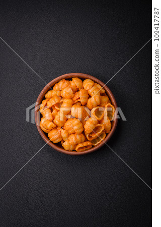 Delicious fresh pasta with pesto sauce, salt, spices and herbs on a ceramic plate 109417787