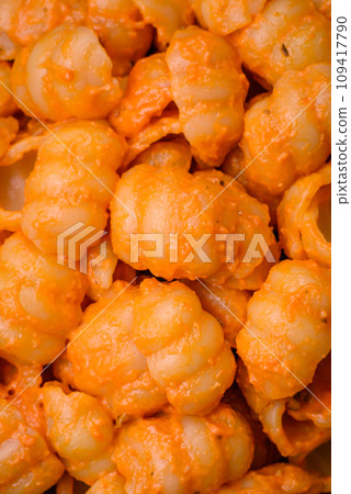 Delicious fresh pasta with pesto sauce, salt, spices and herbs on a ceramic plate 109417790