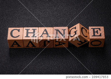 The inscription chance or change with wooden cubes on a dark concrete background The inscription chance or change with wooden cubes on a dark concrete background 109417853