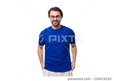 portrait of a young brunette man with a well-groomed beard dressed in a blue t-shirt on a white portrait of a young brunette man with a well-groomed beard dressed in a blue t-shirt on a white 109418220