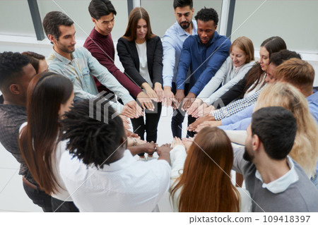 Narrow banner of multiracial people stack hands motivated for shared business success or goal achievement. 109418397