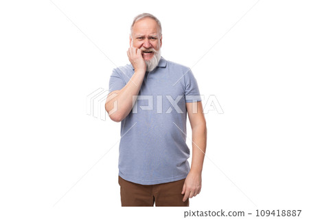 portrait of a gray-haired mature man with a beard and mustache in a t-shirt and trousers on a white portrait of a gray-haired mature man with a beard and mustache in a t-shirt and trousers on a white 109418887