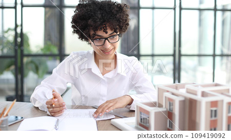 female architect designer examines house layout female architect designer examines house layout 109419092