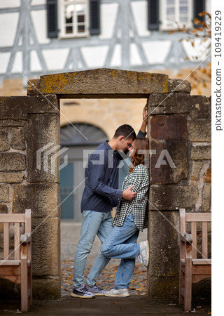 Young Cute Female Hugs Boyfriend. In Autumn Outdoor. Lovers Walking in Park. Attractive Funny Couple. Lovestory in Forest. Man and Woman. Cute Lovers in the Park. Family Concept. Happy Couple. 109419229