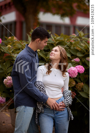 Young Cute Female Hugs Boyfriend. In Autumn Outdoor. Lovers Walking in Park. Attractive Funny Couple. Lovestory in Forest. Man and Woman. Cute Lovers in the Park. Family Concept. Happy Couple. 109419235