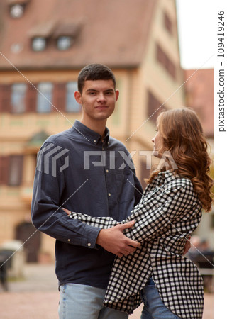 Young Cute Female Hugs Boyfriend. In Autumn Outdoor. Lovers Walking in Park. Attractive Funny Couple. Lovestory in Forest. Man and Woman. Cute Lovers in the Park. Family Concept. Happy Couple. 109419246