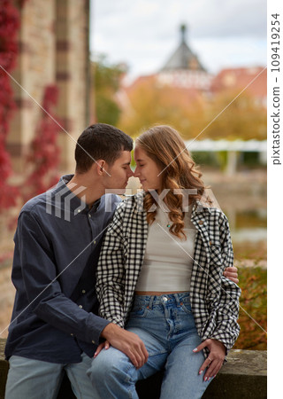 Young Cute Female Hugs Boyfriend. In Autumn Outdoor. Lovers Walking in Park. Attractive Funny Couple. Lovestory in Forest. Man and Woman. Cute Lovers in the Park. Family Concept. Happy Couple. 109419254