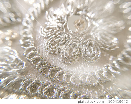 White elegant beaded embroidery motif lace fabric material texture 109419642