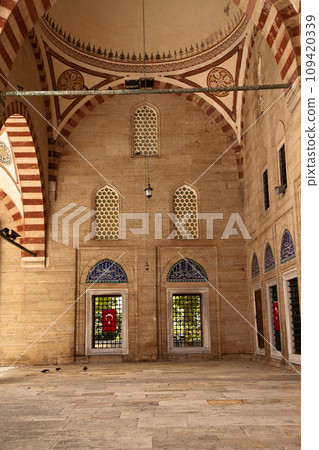 Statue of Mimar Sinan, who built the Selimiye Mosque in 1575, and big cannons, 09 August 2019 Turkey Edirne 109420339