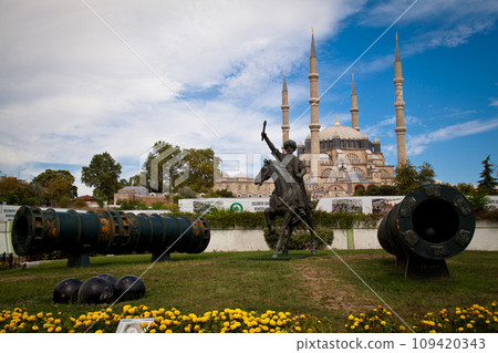 Statue of Mimar Sinan, who built the Selimiye Mosque in 1575, and big cannons, 09 August 2019 Turkey Edirne Statue of Mimar Sinan, who built the Selimiye Mosque in 1575, and big cannons, 09 August 2019 Turkey Edirne 109420343