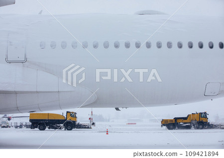 Winter frosty day at airport during heavy snowfall. 109421894