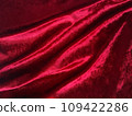 Shiny draped red velvet fabric pattern material 109422286
