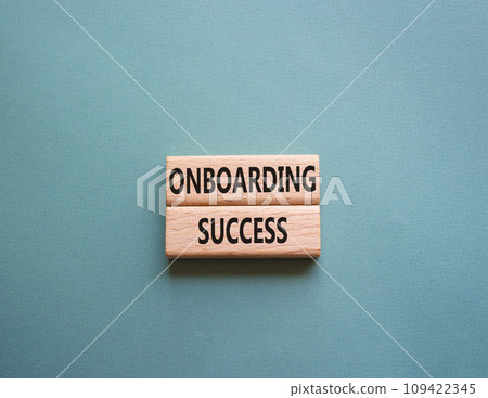 Onboarding Success symbol. Concept word Onboarding Success on wooden blocks. Beautiful grey green background. Business and Onboarding Success concept. Copy space 109422345