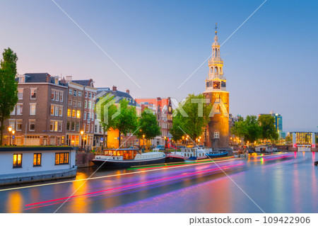 Montelbaan tower, Amsterdam, Netherlands. Evening cityscape. Dark sky and city lights. 109422906