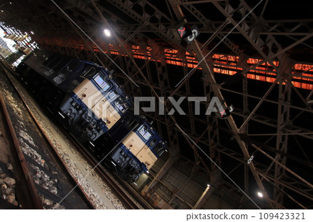EF64-1030 and EF64-1032 standing in a retro vehicle garage_Photographed on November 25, 2023 109423321