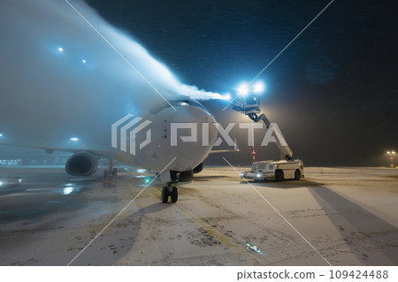 Deicing of airplane at airport. Deicing of airplane at airport. 109424488