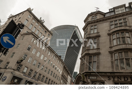 The 20 Fenchurch Street Walkie Talkie Building in London overshadows surrounding older buildings. 109424895