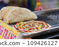 Grilled vietnamese pancake with eggs sausages and sauces in vietnamese night market 109426127