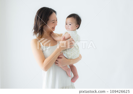Woman holding a baby Woman holding a baby 109426625