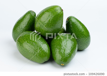 Pile of group green avocados 109426890