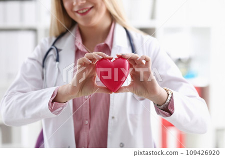 Beautiful smiling blond female doctor hold Beautiful smiling blond female doctor hold 109426920