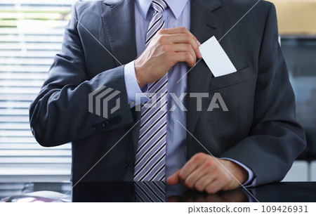 Male arm in suit give blank calling card 109426931