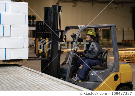 man riding a forklift 109427337